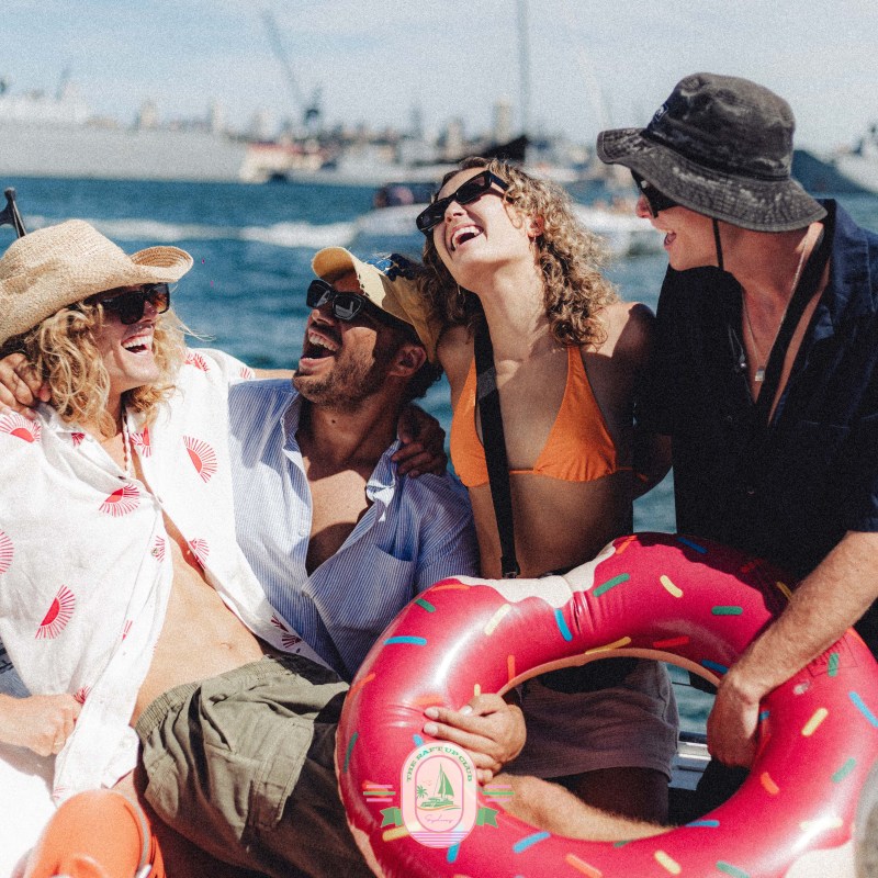 a group of people sitting at a beach