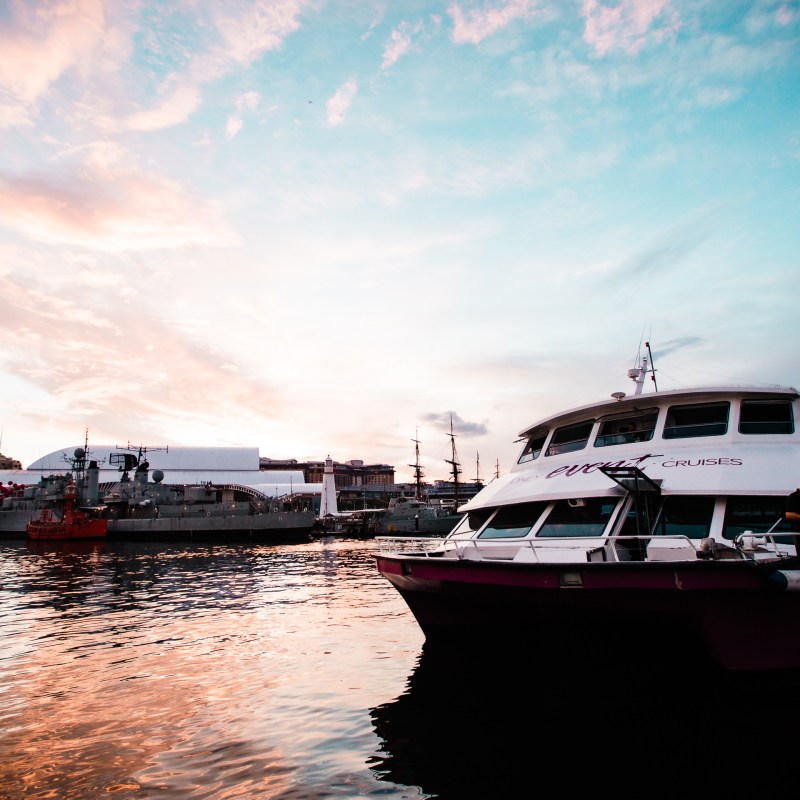 a boat is docked next to a body of water