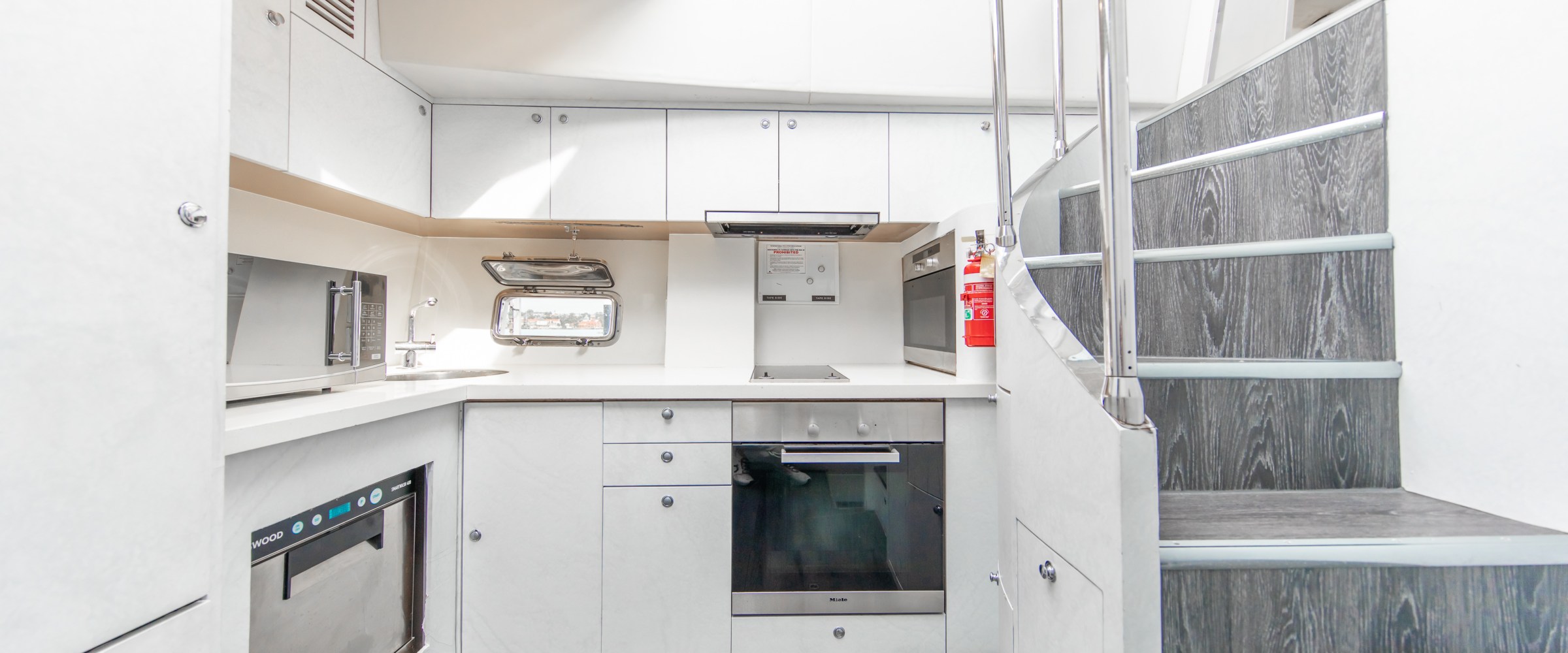 a stove top oven sitting inside of a kitchen